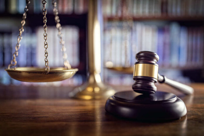 shutterstock_376319674.jpg featured image Scales and gavel on a judge's desk.