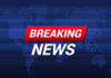 Breaking News text on world map background.
