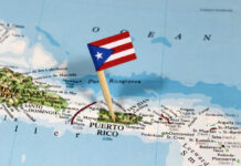 Puerto Rico map with flag on it.