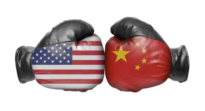 shutterstock_1181921488.jpg featured image American and Chinese flag boxing gloves facing off