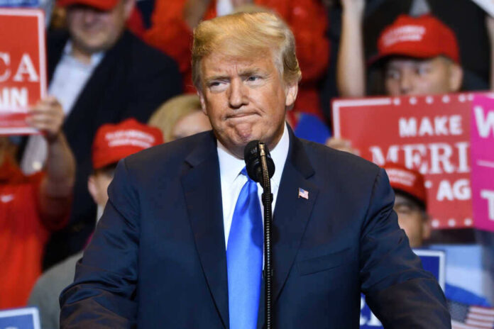Donald Trump at a rally with supporters.