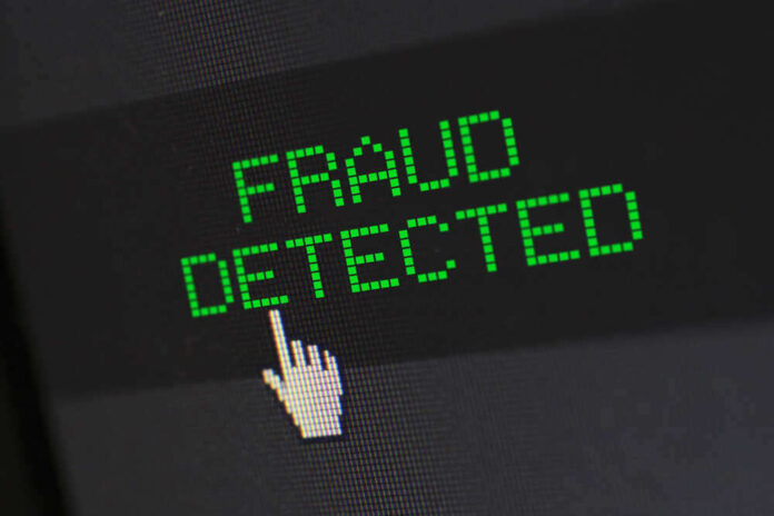 shutterstock_1806836992.jpg featured image Fraud detected text with a pixelated cursor icon.