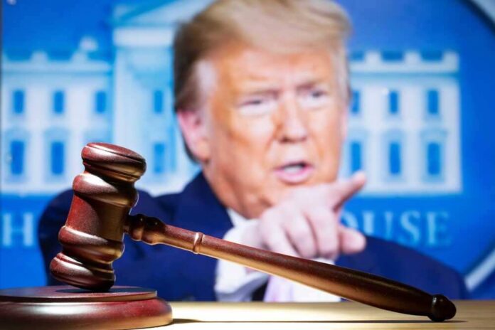 shutterstock_2283594093.jpg featured image Gavel with Donald Trump speaking in the background.