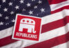 Republican party logo on American flag background.