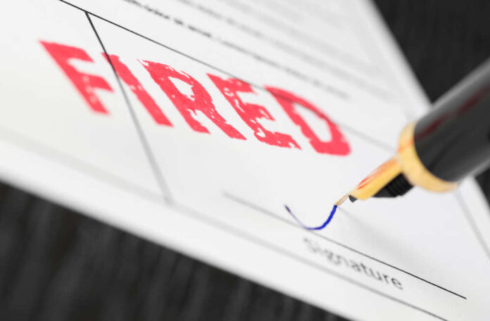 shutterstock_761289151.jpg featured image Fountain pen signing document with the word fired