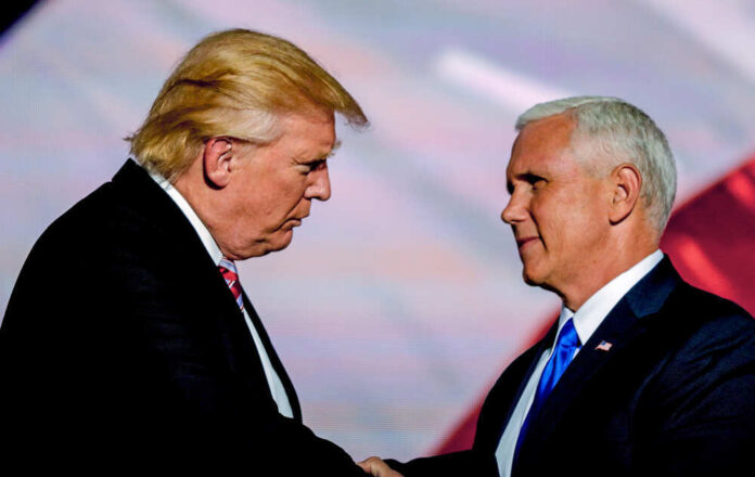 Donald Trump and Mike Pence shaking hands.