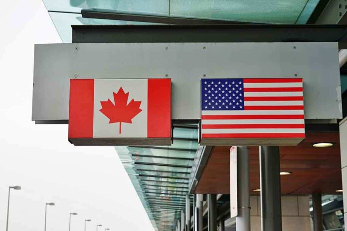 1044483421 featured image Canada and U.S. flags at an airport.