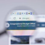 Magnifying glass over Congressional Budget Office website