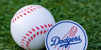 Baseball and Dodgers logo on grass background