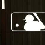 MLB logo with a baseball player silhouette