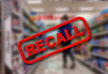Recall stamp on blurred store aisle background