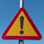 Triangular warning sign with exclamation mark