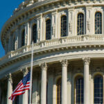US Capitol dome with American flag