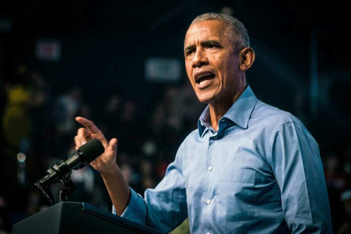 shutterstock_2230017639.jpg Barack Obama speaks at podium