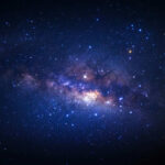 Mysterious Planet Nine: Could It Be Real? Starry night sky with bright Milky Way galaxy