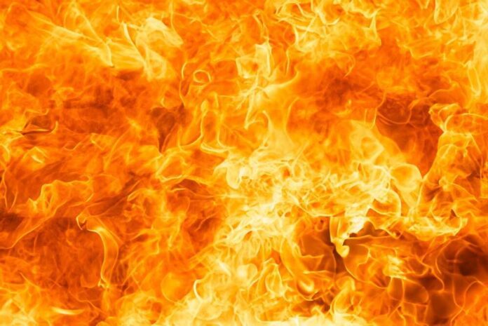 shutterstock_2477449591.jpg featured image Bright orange and yellow flames burning intensely.