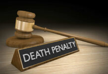Gavel beside death penalty sign on desk