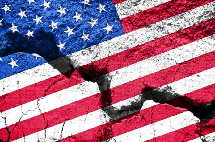 shutterstock_485930149.jpg Cracked United States flag on textured surface