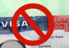 US visa with prohibition symbol overlay