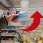Consumers Hurting: Wages Flatline — Prices Still Soar Hand holding credit cards with red upward arrow