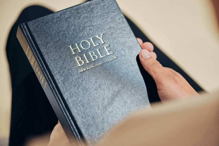 Person holding a Holy Bible, New King James Version