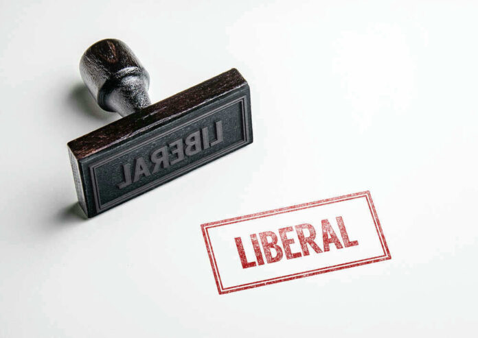Rubber stamp with the word LIBERAL.