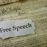 U.S. Constitution with Free Speech text overlay