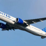 Another United Airlines MELTDOWN! Airplane flying in clear blue sky daytime