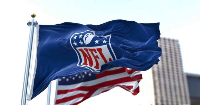 NFL flag waving in front of American flag