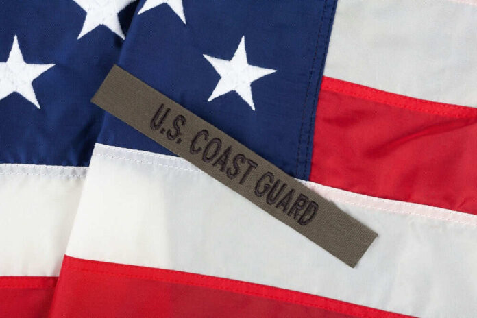 US Coast Guard patch on American flag