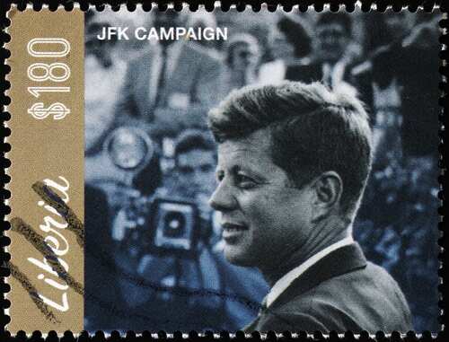 A postage stamp featuring John F. Kennedy during his campaign