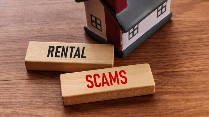 Wooden blocks with the words 'RENTAL' and 'SCAMS' next to a small house model