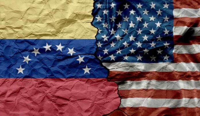Crumpled flags of Venezuela and the United States split in the center
