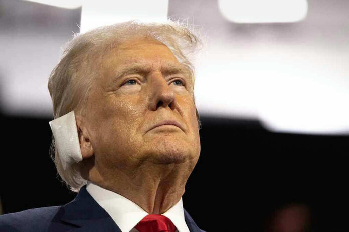 Man with bandage on his right ear.