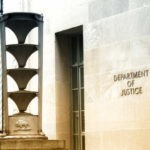 UNPRECEDENTED Criminal Probe Shocks Economic Leaders Exterior view of the Department of Justice building with architectural features