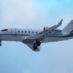 Jet Crashes, Flips Upside Down A private jet approaching for landing against a cloudy sky