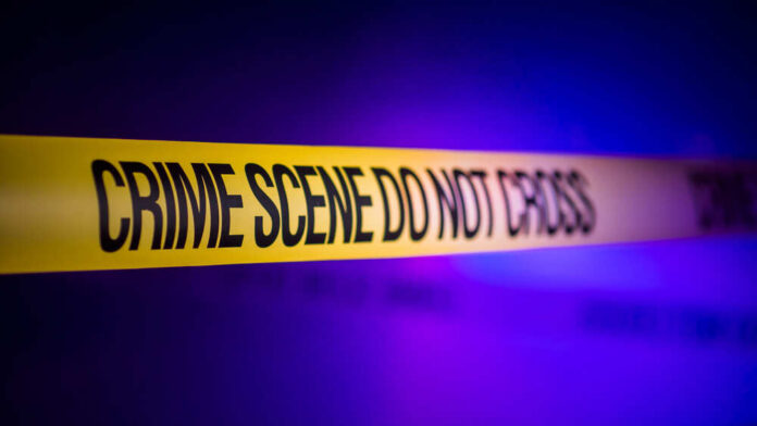 Yellow crime scene tape with the words 'CRIME SCENE DO NOT CROSS'