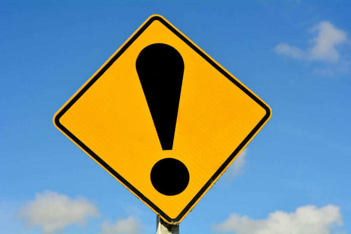 Yellow caution sign with exclamation mark symbol.