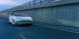 A futuristic car driving on a highway at night