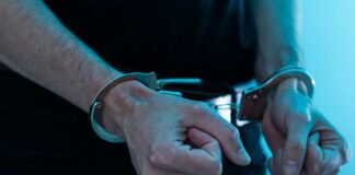 Close-up of hands in handcuffs