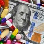 $49 Weight-Loss Pill Sparks Massive Legal Battle A hundred dollar bill surrounded by various colorful capsules and pills
