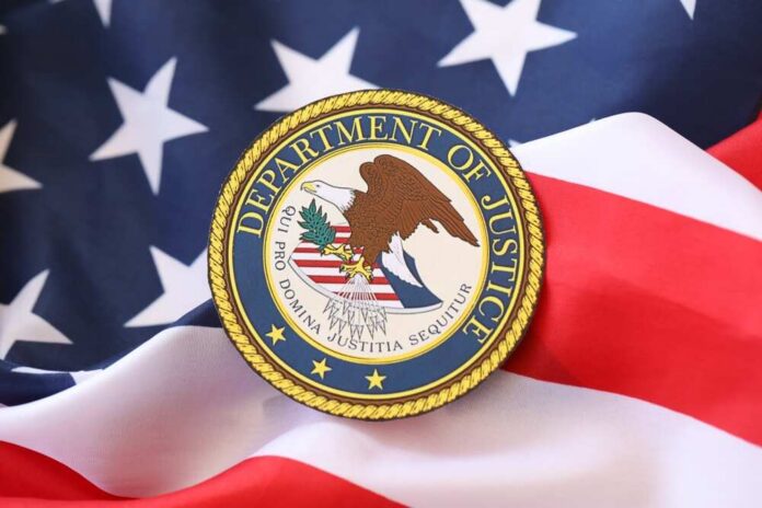 shutterstock_2453164765.jpg Department of Justice seal on an American flag background