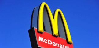 McDonalds logo on a pole clear sky