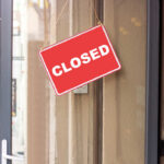 Famed Pizza Chain SLASHING 300 Stores A red 'CLOSED' sign hanging on a storefront door