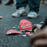 Shattered Make America Great Again hat on the ground