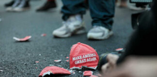 Shattered Make America Great Again hat on the ground