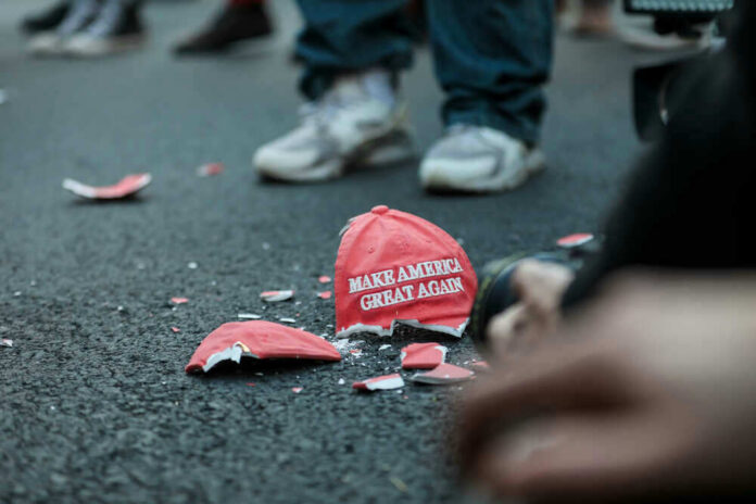 Shattered Make America Great Again hat on the ground