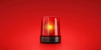 Red emergency light on red background