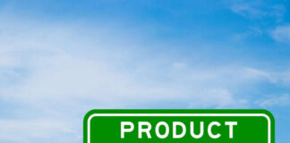 Green sign with product recall text and sky background