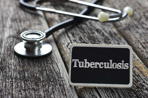 A stethoscope next to a sign reading 'Tuberculosis'